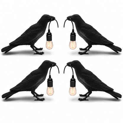 Black raven lamp switched off, showing matte resin bird sculpture