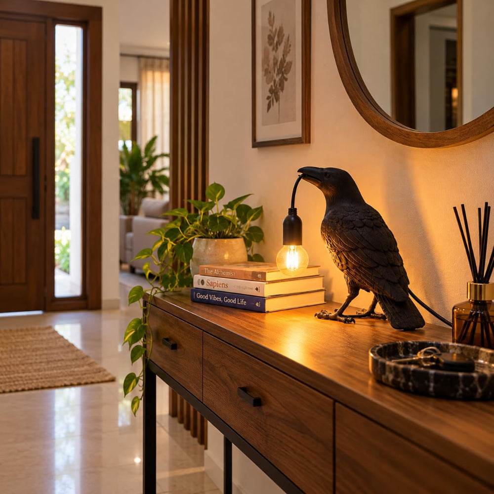 Side profile of resin raven table lamp showing detailed feathers