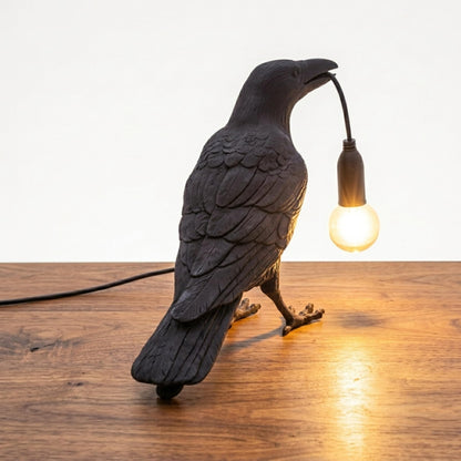 Warm glowing crow bird lamp in a dim room for relaxing evenings